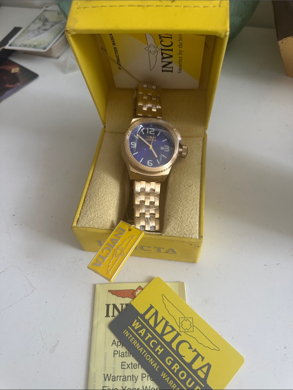 Invicta Gold watch, deep blue face